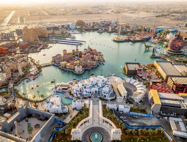 Aerial view of Boulevard World Riyadh showing artificial lake, themed attractions, and large-scale sports facilities and recreation infrastructure.