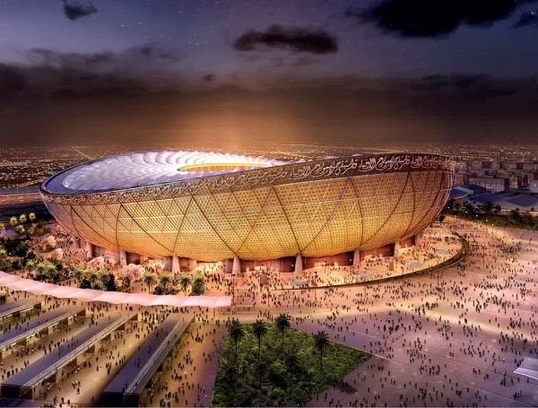 Rendered night view of Lusail Stadium in Qatar illuminated in gold, an 80,000-seat sports facilities venue designed for the FIFA World Cup and future community use.